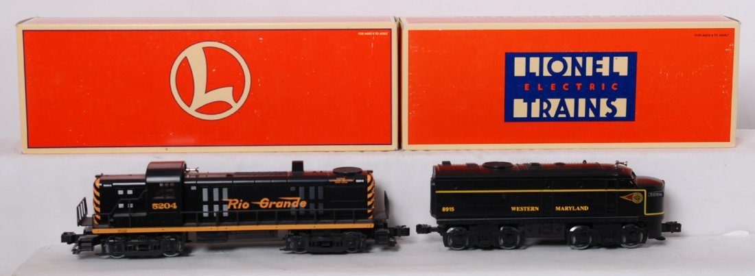 Lionel 18845 Rio Grande RS-3 and 18915 WM Alco: Lionel modern O gauge diesel locomotives in OBs. Includes 18845 Rio Grande RS-3 with horn and 18915 Western Maryland powered Alco A unit. C8 OBs have light corner and edge wear.