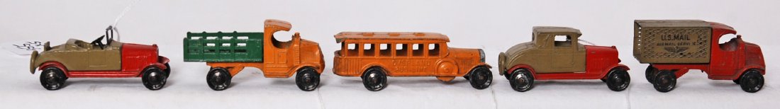 Five earlier Tootsietoy cars, trucks, bus: Earlier Tootsietoy diecast toy vehicles, two Oldsmobile cars, Mack US Mail Air Mail Service, Mack stake side delivery truck, and Overland Bus Line bus. Bus has dinged rear corners and Mail truck has n