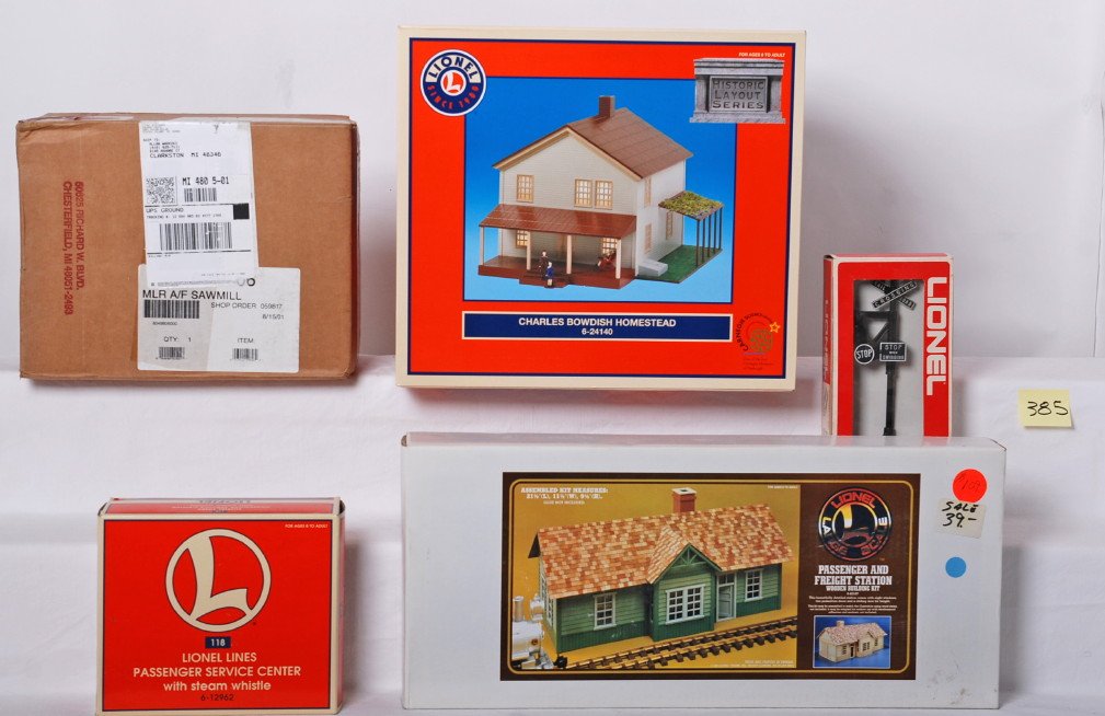 Lionel and Flyer accessories 49806, 24140, 12962, etc: Lionel modern O gauge accessories. Includes 24140 Bowdish homestead, 49806 American Flyer sawmill, 12962 Lionel Lines service center with steam whistle, 2140 banjo signal, and G scale 82107 passenger 