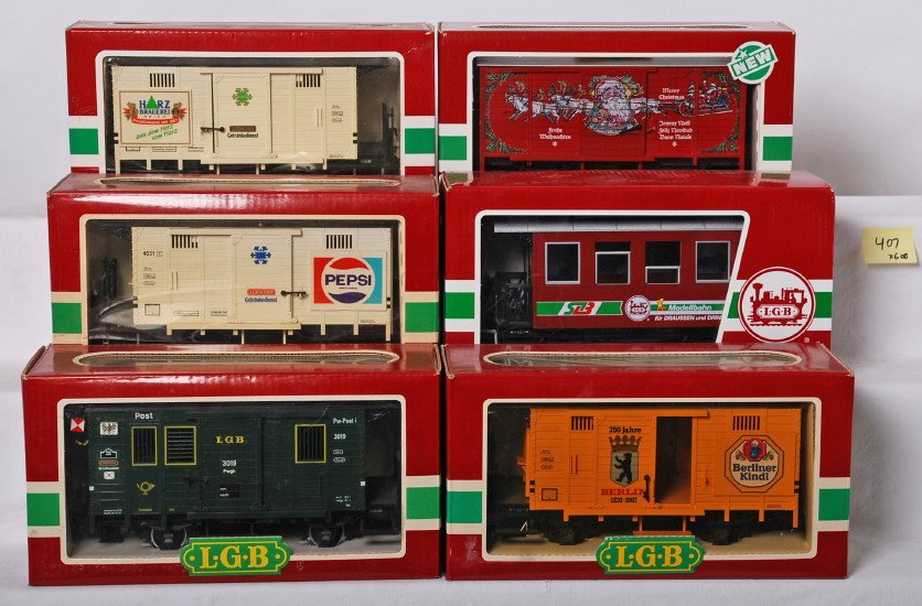 6 LGB freight and passenger cars 4335S, 31075, 3019, 40: LGB modern G scale passenger and freight cars in OBs. Six cars include 4335S Christmas sound boxcar in incorrect box, 4031 Pepsi wagon, 4031IS Harz wagon, 4031B Berliner wagon, 3019 Post wagon, and 31