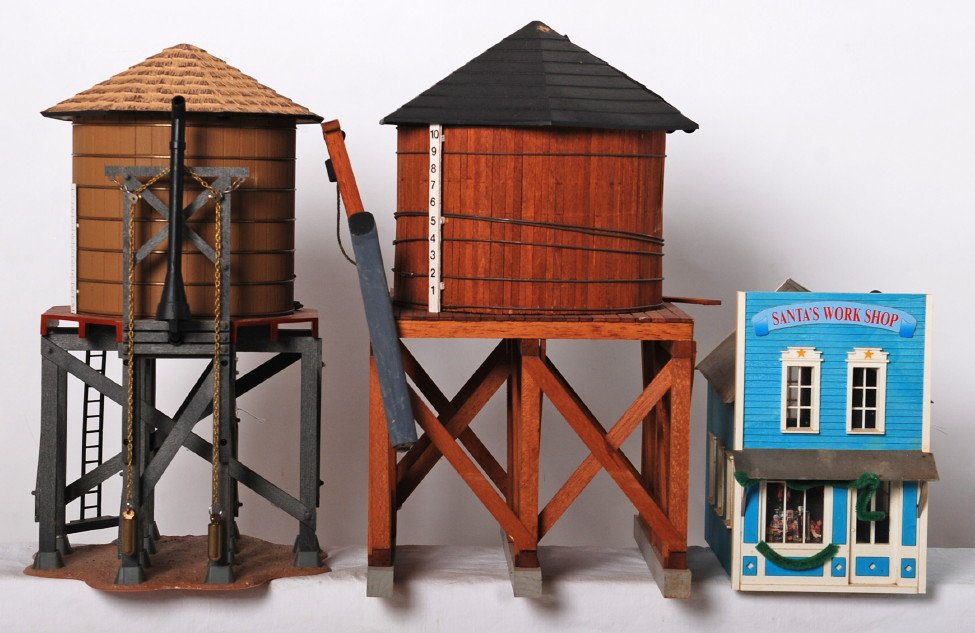 3 G scale water towers and Santas workshop: Modern G scale buildings. Includes two water towers and Santas Workshop. Sold as is. Due to the fragile nature and size of these buildings, we can not guarantee that parts will not come loose during s
