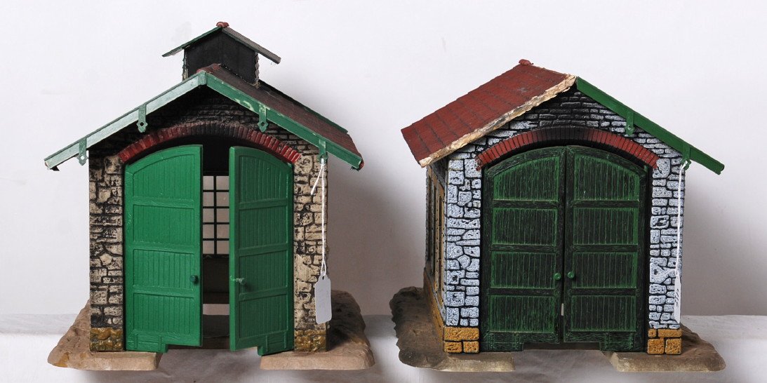 2 G scale engine sheds: Modern G scale engine sheds. Missing some detail parts from roofs. Due to the fragile nature and size of these buildings, we can not guarantee that parts will not come loose during shipping. Also due 