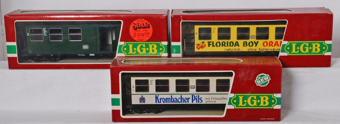 3 LGB passenger cars 3070, 3072, 3172: LGB modern G scale passenger cars in OBs. Three cars include 3072 Florida Boy, 3070 DB, and 3172 Krombacher. Cars are generally C8.