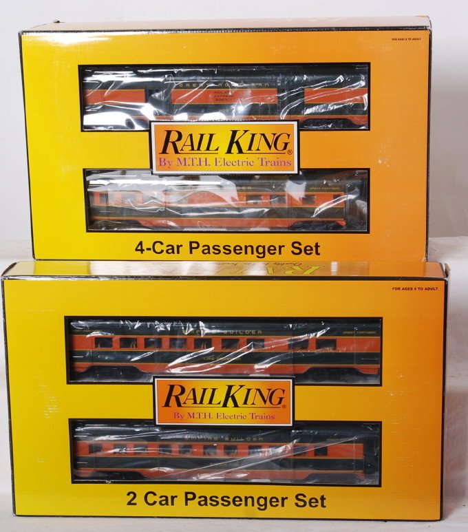 Railking Great Northern six car passenger set: MTH Railking modern O gauge Great Northern passenger cars in OBs. Six cars include 30-67317 sleeper / diner set and 67316 four car set. Cars are C8-9 with light run time. OBs have some light shelf wea