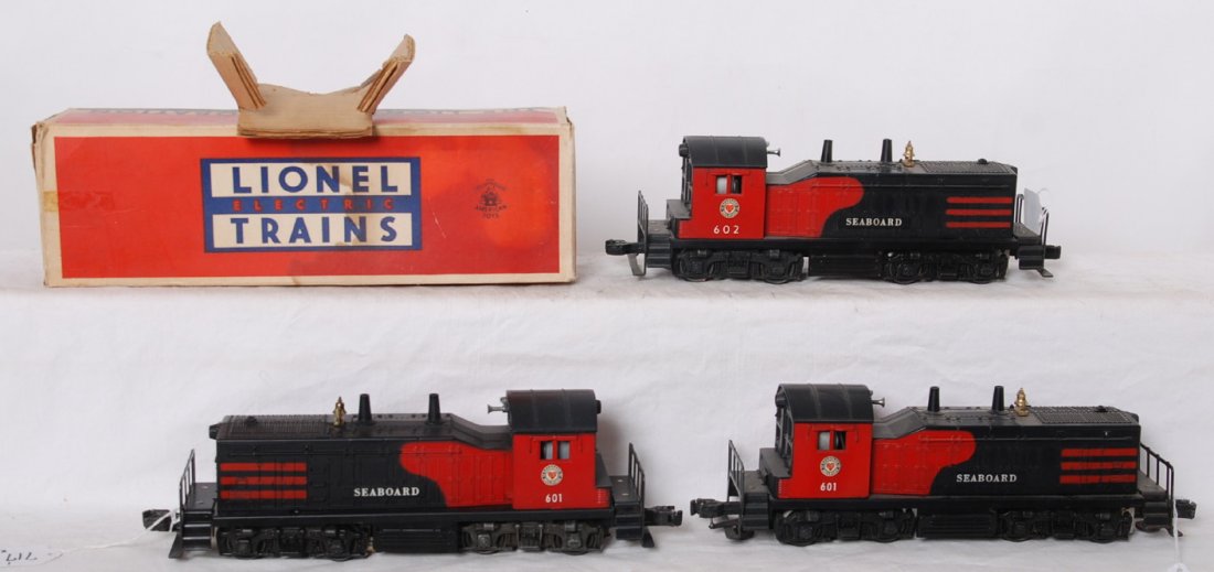 Lionel 601, 601, 602 and one OB w/one insert: Postwar Lionel O gauge NW2 diesel switchers, two 601 and one 602 Seaboard locomotives. 602 has some light surface rust on some wheels. Trains should clean to look C6-7. Box has clear tape on seam, oth