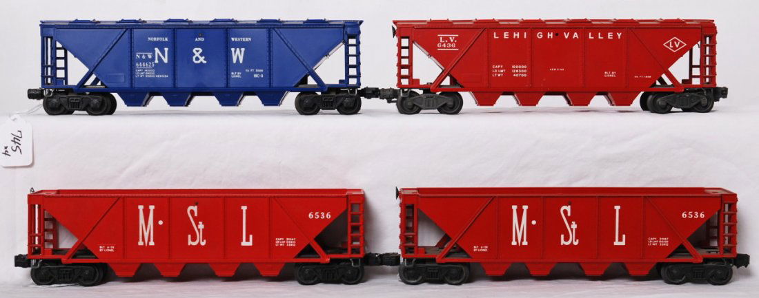 Lionel 6436-110, two 6536, and 6446-25 blue: Postwar Lionel O gauge 6436-110 LV hopper with built date and cover, two 6536 M.St.L hoppers, and 6446-25 N&W hopper in blue (modern era 1970). Trains should clean C6-7.
