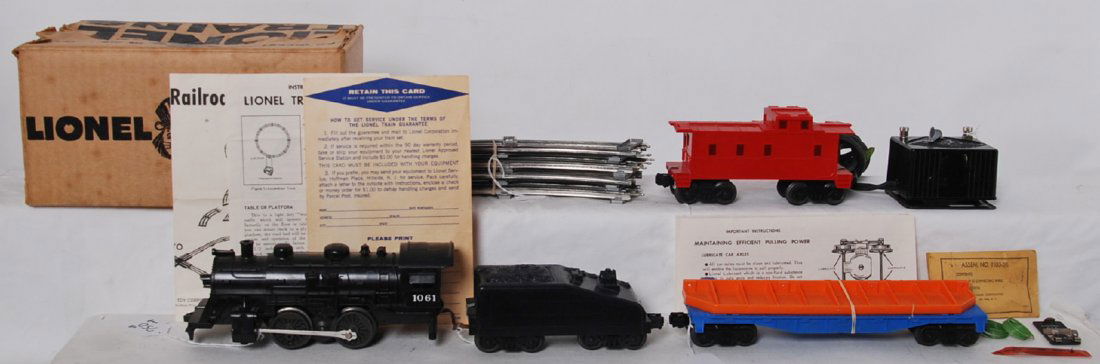 Lionel 11415 027 steam freight set in OB w/components: Postwar Lionel O gauge 11415 027 steam freight set in original box. Set is comprised of; 1061 steam loco and slopeback tender, undecorated flat with bridge girder, and undecorated caboose. Trains look