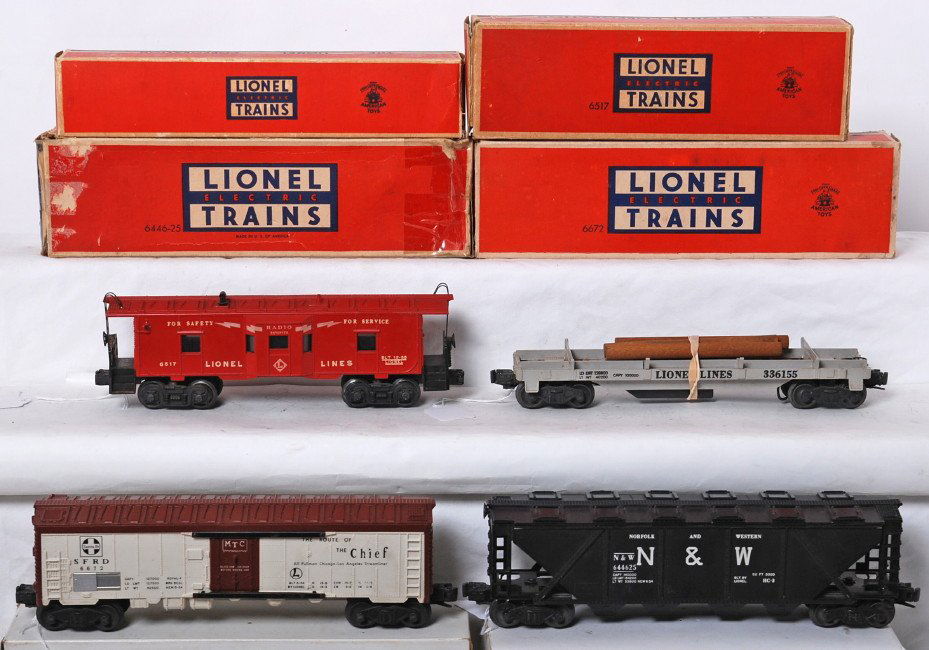 Lionel 6446-25, 3361X, 6672, 6517 in OB: Postwar Lionel O gauge 6446-25 N&W hopper, 3361X operating lumber car, 6672 Santa Fe reefer, 6517 bay window caboose, C7 area. Boxes have missing flaps, tape, tears, etc.