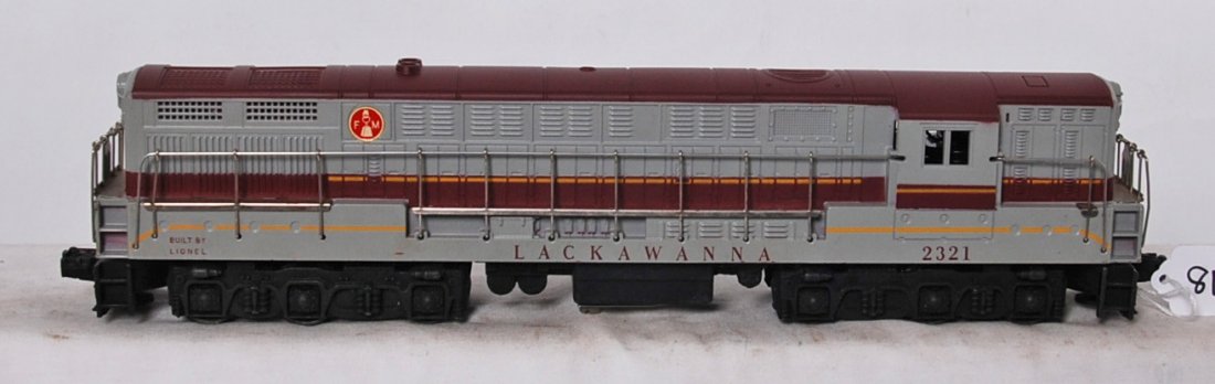 Lionel 2321 Lackawanna FM Trainmaster diesel: Postwar Lionel O gauge 2321 Lackawanna Fairbanks Morse Trainmaster diesel loco, typical hairlines, surface rust on some walkboards, missing horns, otherwise C7. Clean battery compartment.