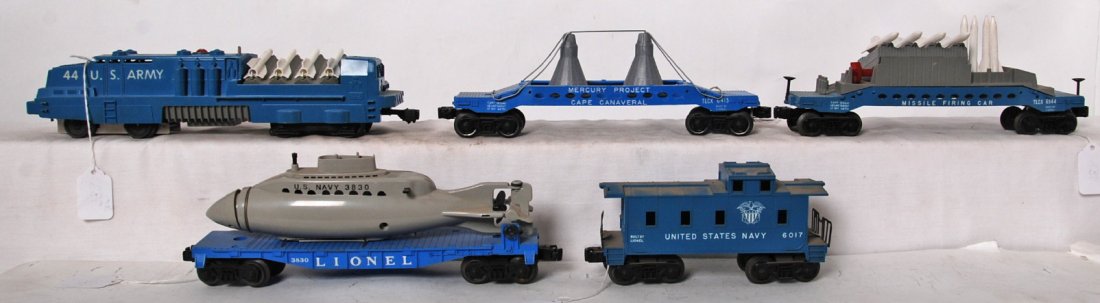 Lionel 44, 3830, 6544, 6413, 6017 Land, Sea, Space: Postwar Lionel O gauge 44 U.S. Army missile launcher, 3830 flatcar w/Reproduction submarine, 6544 missile firing car, 6413 Mercury capsule transport w/Reproduction capsules, 6017 United States Navy ca