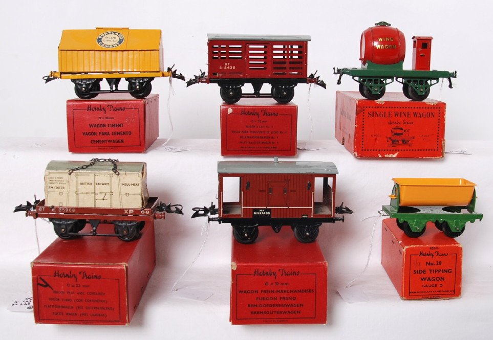 Hornby Trains grouping of six freight cars in original : Postwar Hornby Trains O gauge grouping of six freight cars in original boxes, C7 to C9 area. 42150 flat truck with container, 42170 goods brake van, 42224 No. 20 side tipping wagon, 42115 Portland Cem