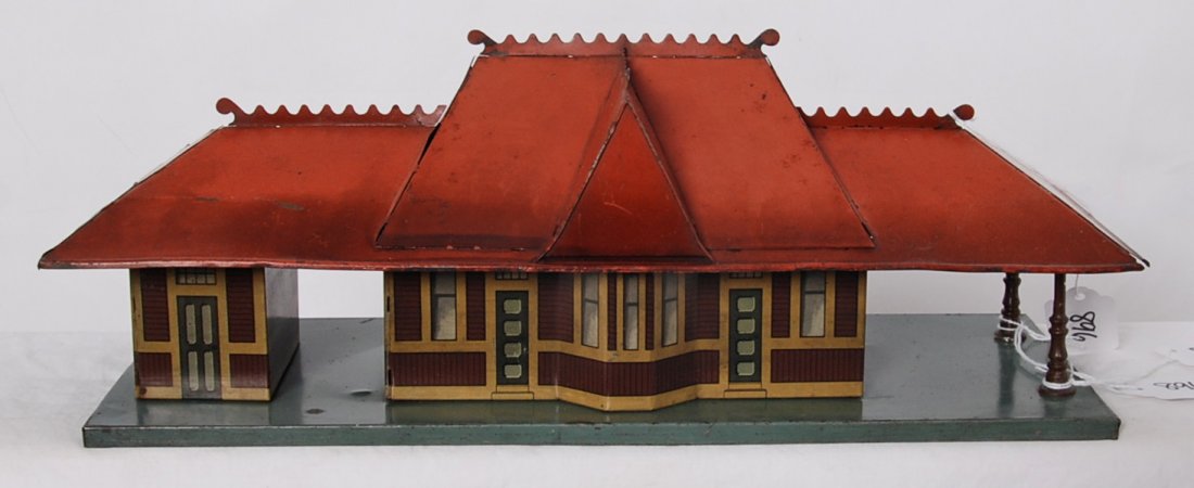 Bing hand painted & lithographed 14Ó station: Prewar Bing O/narrow gauge hand painted and lithographed passenger station w/ticket booth?. Base measures approximately 14-1/4 inches long, 5-1/8 inches wide, and 5 inches to tallest part of roof. Sta