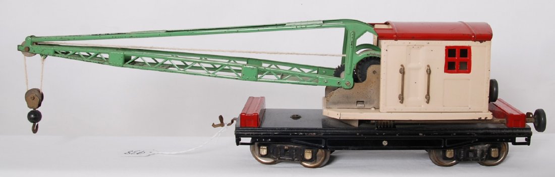Lionel 219 in red, cream, Stephen Girard green, nickel: Prewar Lionel standard gauge 219 operating work crane, red roof and tool boxes, cream cab, Stephen Girard green boom, nickel plates and journals with black knobs. Both latch couplers are missing the l