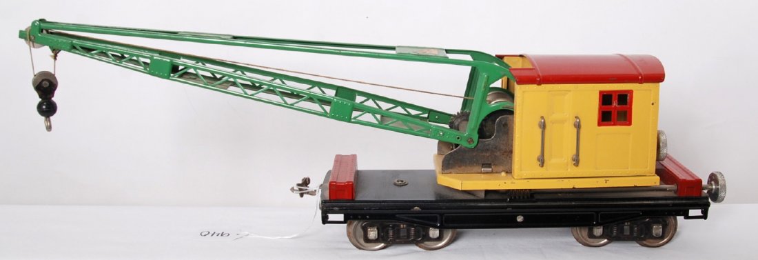Lionel 219 crane in yellow with red and green, nickel: Prewar Lionel standard gauge 219 operating work crane, red roof and tool boxes with yellow cab and green boom. Nickel trim and aluminum knobs. Crane needs some polishing to metal parts mostly wheels, 