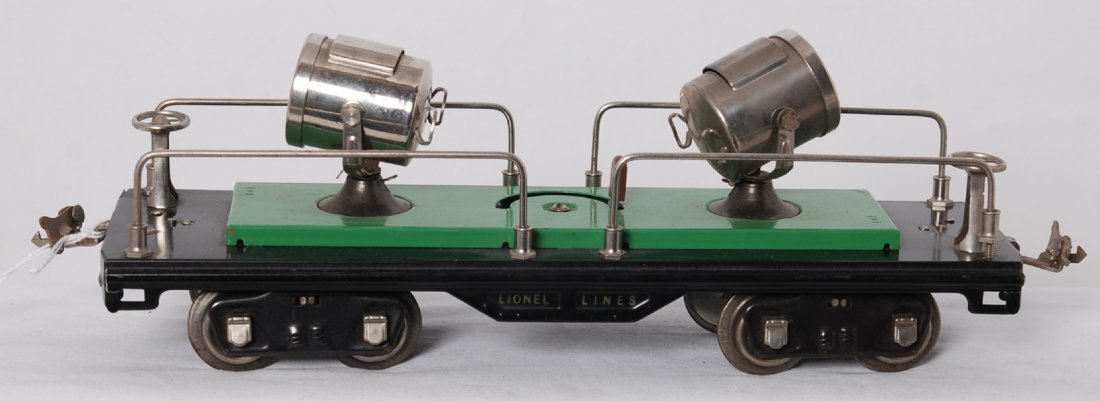 Lionel 520 searchlight car factory repainted first run: Prewar Lionel standard gauge 520 searchlight car, car looks C8 green base on black frame with all nickel trim. However upon very close inspection, there is terra cotta underneath green paint. Car is 1