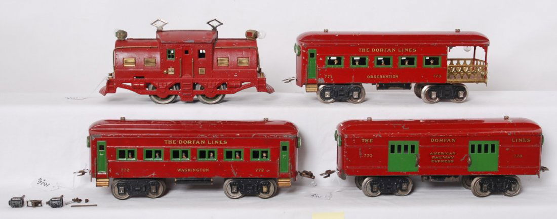 Dorfan Lines electric loco w/770, 772, 773 passengers: Prewar Dorfan wide/standard gauge electric locomotive with three passenger cars, all in matching red paint. Loco is unnumbered with some repainting and repairs, some cracks, and some casting fatigue.