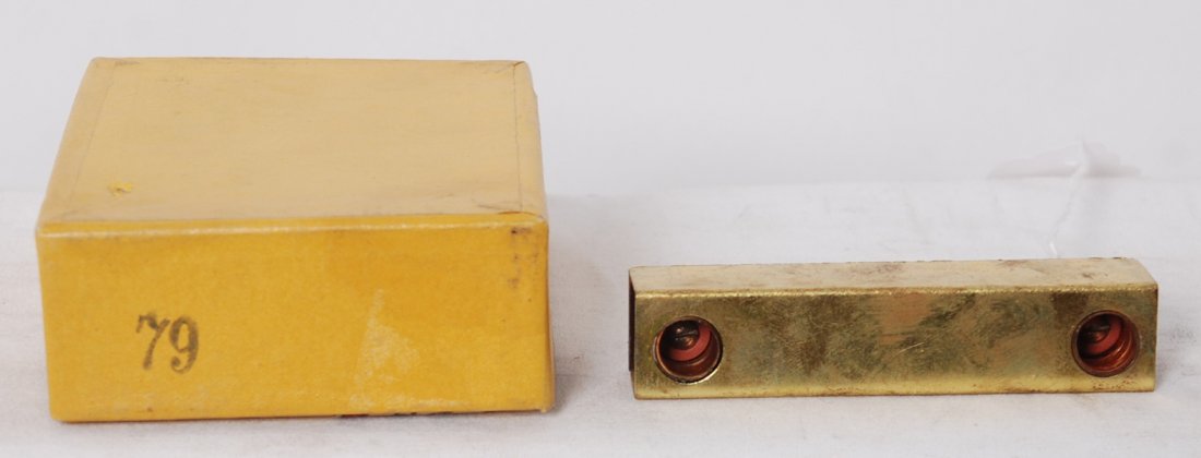 Lionel 79 lighting kit in original box: Prewar Lionel standard gauge No. 79 lighting kit in original box with wax paper and brown paper. Looks unused, C9. Box has tiny puncture to outer surface only of box lid/ Box is very square and solid 