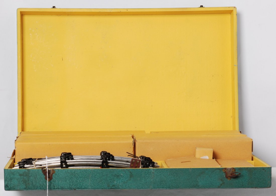 Neat Paya suitcase type set box with inner boxes, track: Postwar Paya O gauge suitcase type set box with empty inner train boxes, track, bottle of lubricant or smoke, and inserts. Overall these items would look best with at least a C7 set up to lower C9 are