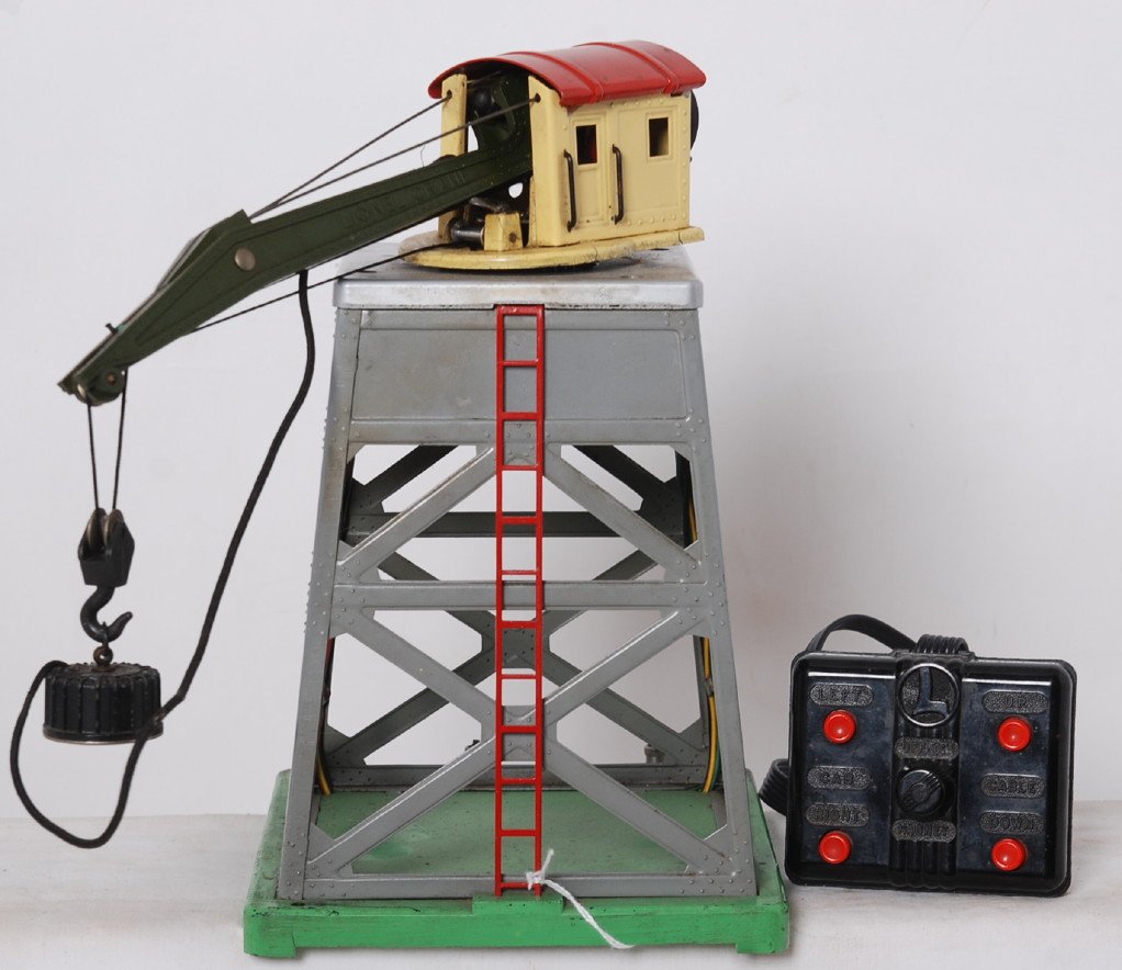 Lionel 165 remote control magnetic crane w/controller: Prewar Lionel O gauge 165 remote control magnetic crane with nicely wired controller. Base of derrick has casting fatigue and needs restored. Rest of crane looks C6.