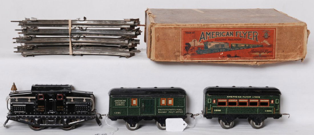 American Flyer narrow gauge train set in OB: Prewar American Flyer narrow gauge electric passenger set with original box. 1218 center cab electric locomotive with 1205 RPO car, 1306 passenger coach, C6 with some surface rust here and there. Trai