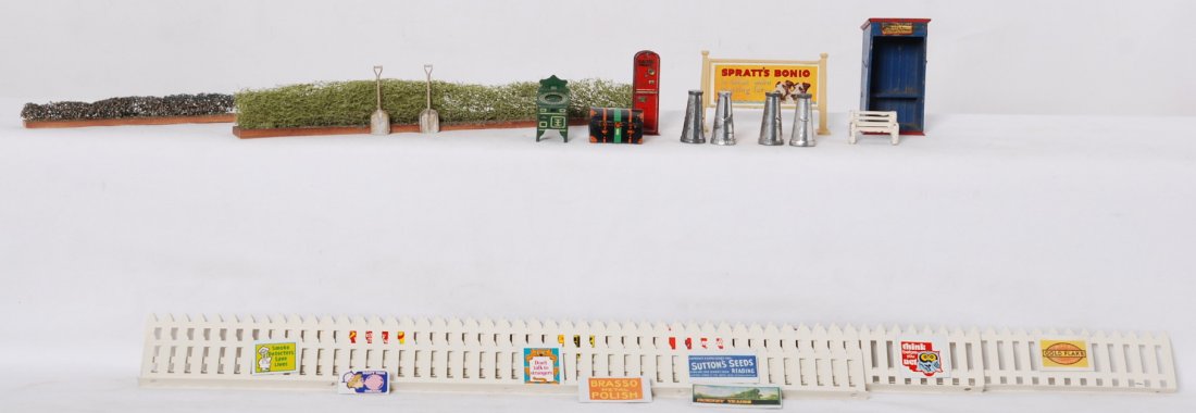 Hornby freight station hoardings/accessories: Hornby freight station hoardings/accessories. Four tin milk cans, platform tickets machine, machine with letters on face, trunk, billboard, bench, passenger shack, shovels, reproduction fence signs, a