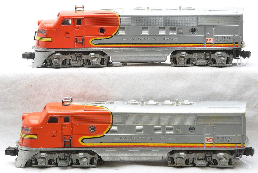 Lionel 2343 Santa Fe F3 AA Diesel Units.: Lionel postwar 2343 Santa Fe F3 AA diesel units. The power A unit is missing one porthole cover. All other portholes are reproduction. The power A unit has one step broken off. Both units have paint t