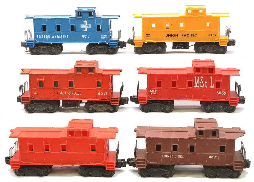 Lionel Cabooses 6017 6017 6167 6049 6017 6067: Lionel postwar cabooses; 6017 Boston and Maine, 6017 A.T.&S.F., 6167 Union Pacific, 6059 Minneapolis & St. Louis, 6017 brown with a chipped corner and a 6067 unmarked red. All of the cabooses have inc