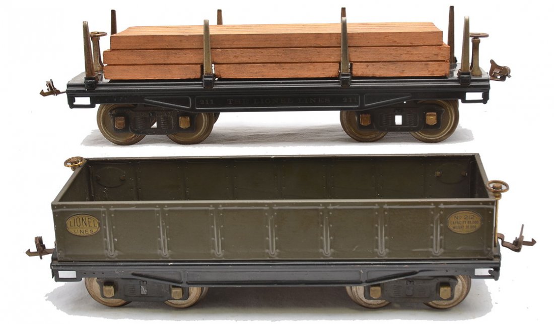 Lionel 211 Flatcar w/Wood 212 Gondola: Lionel prewar standard gauge 211 black flatcar with wood load, brass trim, nickel stakes and journals and a 212 gray gondola with brass trim and nickel journals. The couplers, wheels and trim have sur
