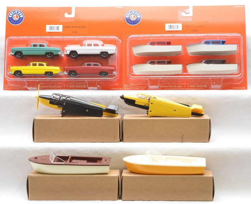 Lionel 37820 37834 Repro Loads 2-Boats 2-Planes: Lionel 37820 four pack of autos and 37834 four pack of boats both factory sealed in blister packs, C10. Also included are reproduction loads including; B801 boat with white hull and brown deck, B801 b