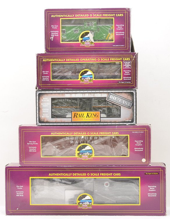 MTH NP 20-98744 20-97502 20-98718: MTH Northern Pacific freight cars including; 20-98744 crane car, 20-97502 wood chip hopper with chip load, 20-98718 operating log car and a 20-91250 extended vision caboose all in OBs that are worn. A