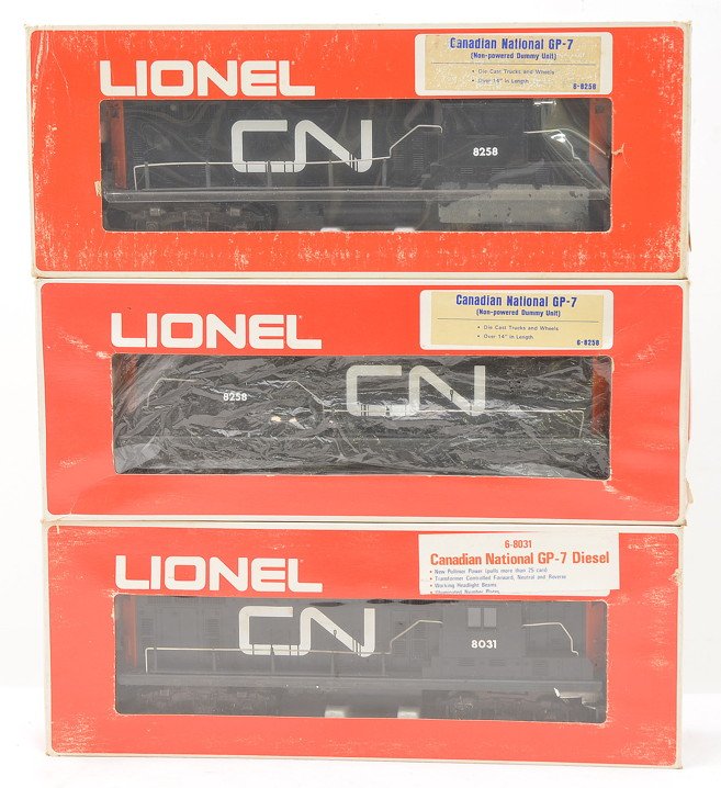 Lionel Canadian National 8031 8258 8258 GP7: Lionel Canadian National 8031 GP-7 powered diesel unit and two 8258 GP7- non-powered dummy units all in OBs, C8. The boxes show wear.