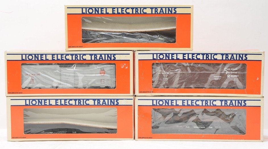 Lionel CP 6233 6233 17200 17200 17500 Boxed: Lionel Canadian Pacific freight cars; two 6233 flatcars one with a broken truck, two 17200 boxcars and a 17500 flatcar with logs all in OBs. The cars have never been run, C9. Boxes show some wear.