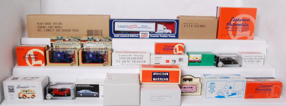 Large group of Lionel and other die cast vehicles: Diecast vehicles from Eastwood, Road Champs, Ertl, etc. Includes 424500 Airport truck set, 19-2062 Lionel police car, 426000 ambulance set, Lionelville farms milk truck, Lionel 1955 delivery truck, 19