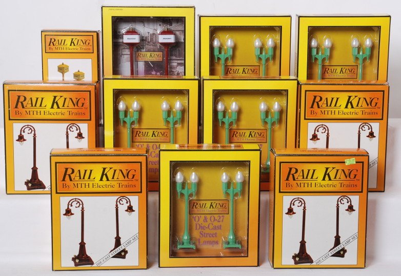 10 Railking street lamp sets 57, 59, 580-2: MTH Railking modern O gauge / standard gauge lamp sets in OBs. Ten sets include four MT-1030 No. 59 sets, five 30-1071 No. 580-2 sets, 30-1084 No. 57 and MT-1028 No. 57 set. Sets are generally C8. OBs