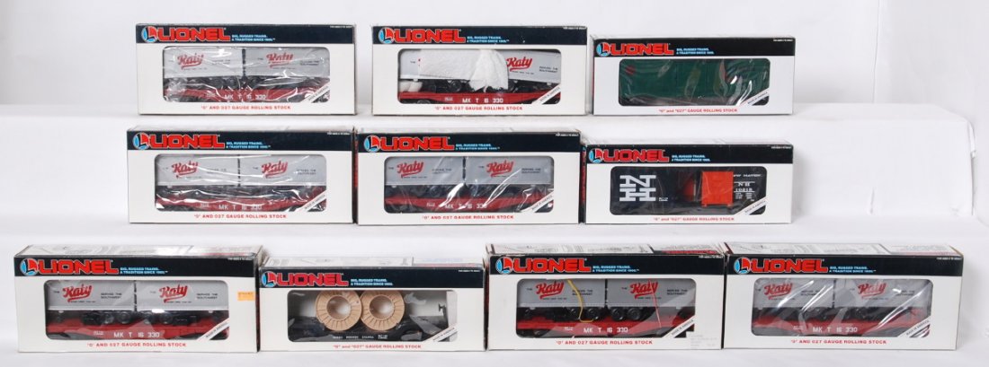 10 Lionel freight cars 16330, 16324, 19218, 19233: Lionel modern O gauge freight cars in OB. Ten freight cars include seven 16330 MKT flats with trailers, 16324 Pennsylvania flat with cable reels, 19218 New Haven boxcar, and 19233 Southern Pacific box