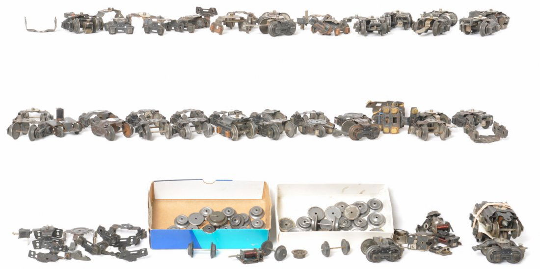 Lionel & A.F. prewar O gauge truck assemblies, wheels: Prewar American Flyer and Lionel O gauge freight and tender truck assemblies with wheels and couplers, wheels, couplers, etc. Sold as is shown in our photos with no returns. One of many parts lots. On