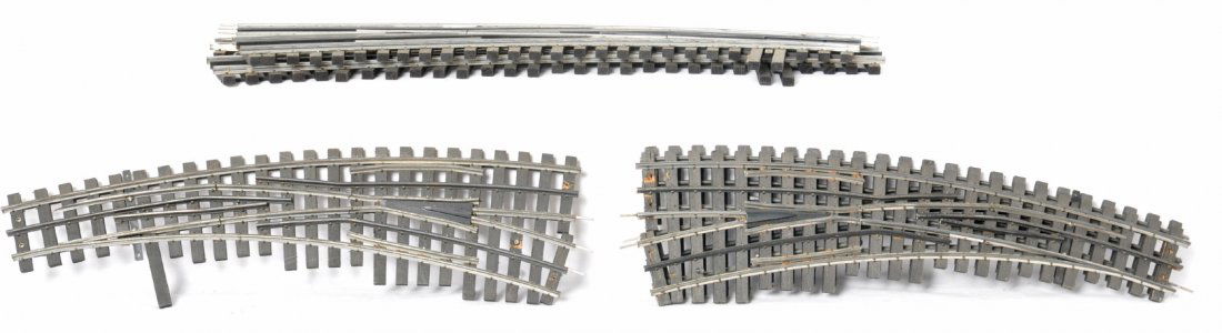 5 Ross switches, curved, etc: Ross modern O gauge switches. Includes wide radius left hand switch, two curved left hand switches and one right hand switch (maybe #6?) and one wide curved left hand switch (maybe a #8) Switches are