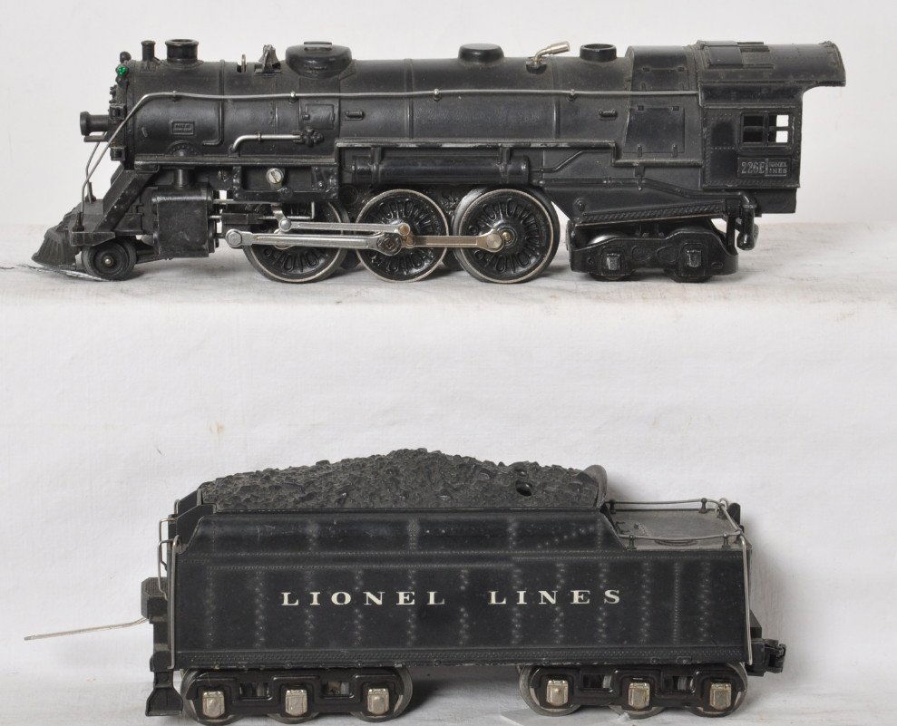 Lionel 226E locomotive and 2226W whistle tender: Lionel Prewar O gauge 226E steam locomotive with 2226W whistle tender. Tender coupler has been switched to knuckle style coupler. One marker jewel missing and some paint chips on the loco, tender lett