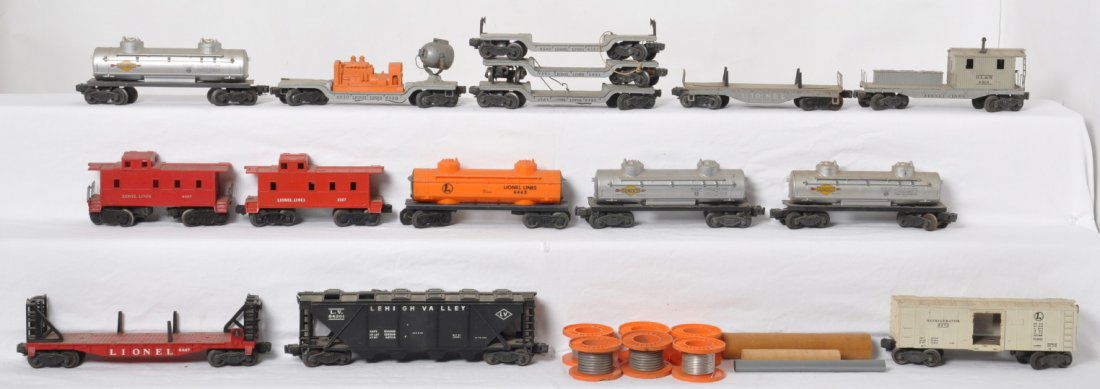 Lionel O gauge freight cars, 6436, 6472, 6520, more: Postwar Lionel O gauge freight cars with some missing trim, broken trim, missing parts, etc. sold as is shown in our photos with no returns. 6436 LV hopper, 2461 and two 6561 flatcars, unnumbered pipe