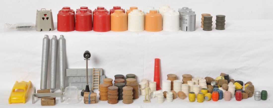 Lionel barrels, canisters, auto, 70 yard light, more...: Postwar Lionel O gauge components, pieces, parts, etc. Most everything appears original. Some are damaged. Still a nice usable lot. Sold as is shown in our photos with no returns.