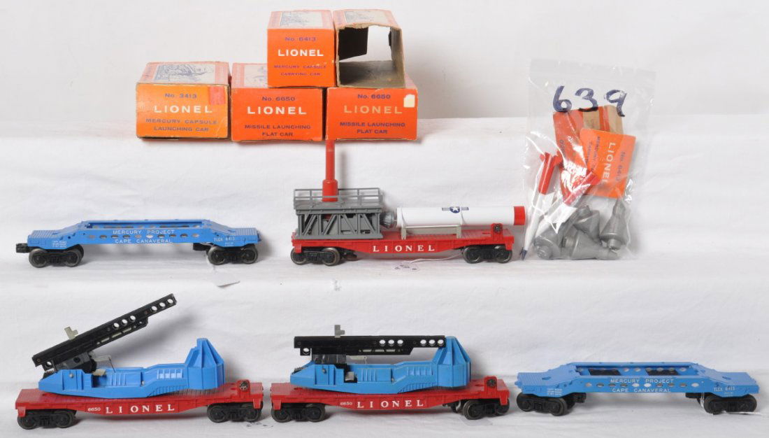 Lionel 3413, two 6650, and two 6413 in OB: Postwar Lionel O gauge 3413 Mercury Capsule launching car, two 6413 Mercury Capsule carrying cars, and two 6650 missile launching flatcar, in original boxes. Trains look C6-8. 3413 rocket is reproduct