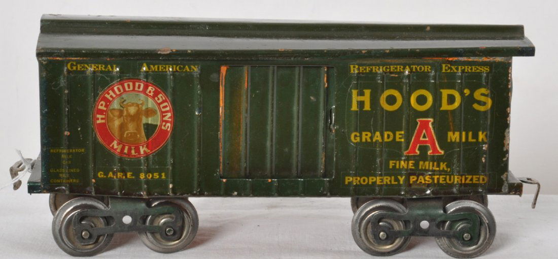 Lionel 114 boxcar nicely redecorated as HoodÍs Milk: Prewar Lionel standard gauge 114 boxcar, older redecorating as a HoodÍs milk car. Train looks C6 area.
