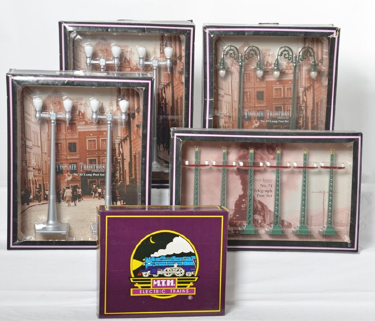 MTH Tinplate lamp and telegraph sets: MTH modern standard gauge tinplate accessories in OBs. Includes 10-1095 N. 67 lamp set, two 1108 No. 63 lamp post sets, 10-1094 No. 71 telegraph set, and MT-1019 No. 54 lamp set. Items are generally C