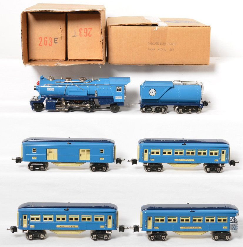MTH tinplate O gauge Blue Comet set: MTH modern O gauge reproduction tinplate Blue Comet set in OBs. Include 263E and 263W tender and five car passenger set with nickel trim and journals. Trains are C7-8 with run time. One or two small p
