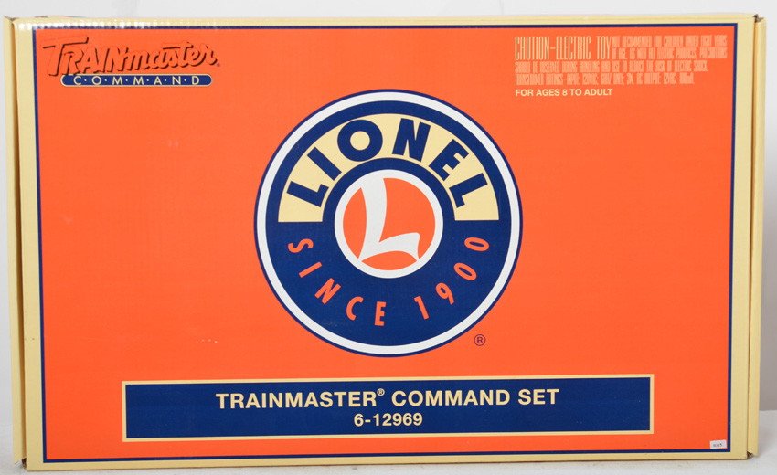 Lionel 12969 TMCC command set: Lionel modern O gauge 12969 Train master command base set. Includes Cab-1 remote and command base. Set is C8 with some signs of use. OB shows some light corner wear.