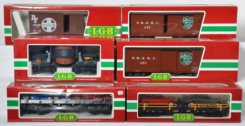 6 LGB freight cars 42590, 48670. 4067, etc: LGB modern G scale freight cars in OBs. Includes two 48670 Sandy River boxcars, 4067 D 03 Santa Fe boxcar, 41560 slag car, 42590 flat with autos, and 4059 flat with autos. Cars are generally C8. OBs h