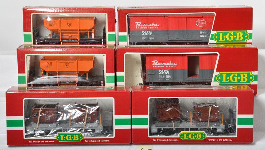 6 LGB freight cars 4041, 4067, 41140: LGB modern G scale freight cars in OBs. Six cars include two 4041 orange hopper cars, two 4067 F 01 New York Central boxcars, and two 41140 flat with containers. Cars are generally C8 with run time. O