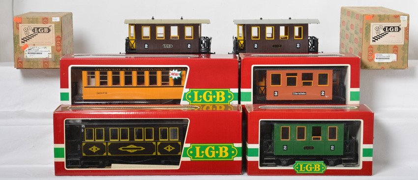 6 LGB passenger cars 3009, 3000, 30800, 3061, etc: LGB modern G scale passenger cars in OBs. Six cars include 3000 2/2 coach missing brake wheel, 3000 2/2 coach, 30800 Denver & Rio Grande Western coach, 3061 Baumer coach with cracked truss rod, 3007 c