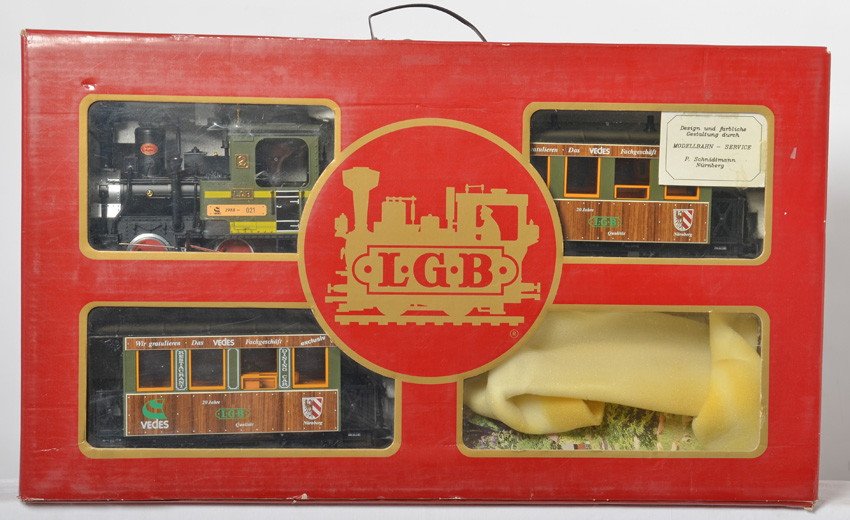 LGB 1988 Vedes 20th anniversary set: LGB modern G scale 1989 Vedes 20th anniversary set in OB. Set is 1988VCL. Set is C7-8 with run time and a few small paint nicks and set is missing one coach. Set box has light wear, especially around 
