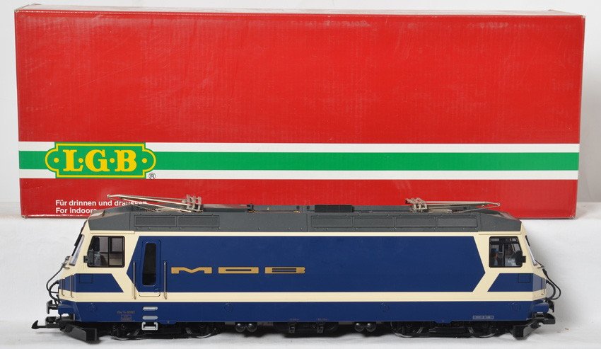 LGB 20420 Swiss MOB electric locomotive: LGB modern G scale 20420 Swiss MOB electric locomotive in OB. Loco is C8 with run time and some light shelf dust, loco is missing one front hand rail. OB has some light corner and edge wear.